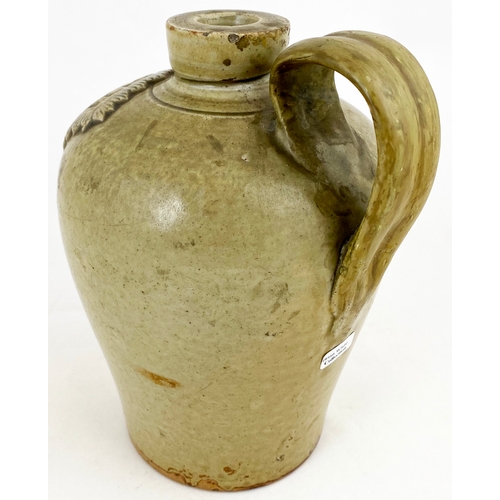 354 - RETFORD MINIATURE SEALED FLAGON. 7.5ins tall. Grey green slip glaze, rear handle. Slab fills entire ... 