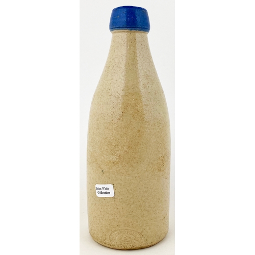 524 - WIGAN GINGER BEER BOTTLE. 7.75ins tall. Ch, blue lip, all white body. SCHOLES/ BRIDGE, plant pictori... 