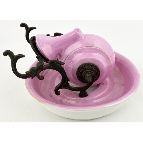 571 - CERAMIC SNAIL INKWELL. 5.5ins base diam. Bright pink snail shaped well set on a similar coloured bas... 