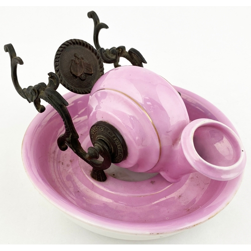 571 - CERAMIC SNAIL INKWELL. 5.5ins base diam. Bright pink snail shaped well set on a similar coloured bas... 