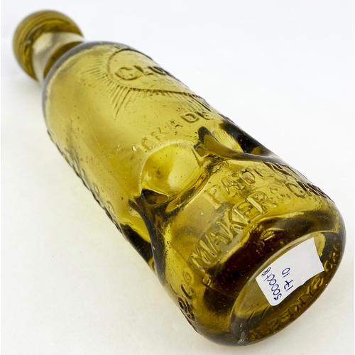 553 - SALFORD SYKES MACVAY PATENT BOTTLE. 7.25ins tall, amber glass. Six circular base indents, bottle lip... 