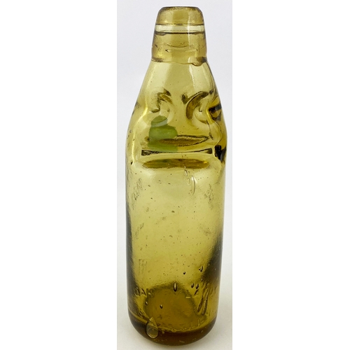 556 - LANDPORT AMBER CODD BOTTLE. 8.75ins tall, 10 oz capacity, aqua marble, 4 neck retaining lugs. Emboss... 