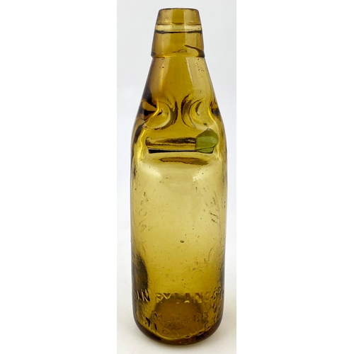 557 - LANDPORT AMBER CODD BOTTLE. 9ins tall 10 oz capacity, aqua marble, 4 neck retaining lugs. Embossed W... 