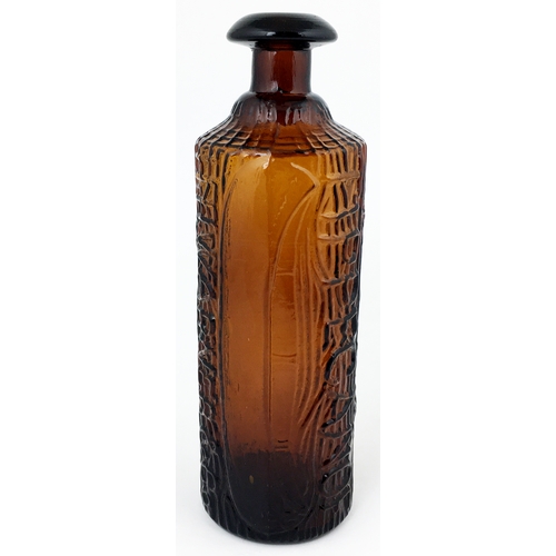 610 - TIPPECANOE BOTTLE. 9.2ins tall. Dark red-amber, heavily embossed canoe & log effect, domed mushroom ... 