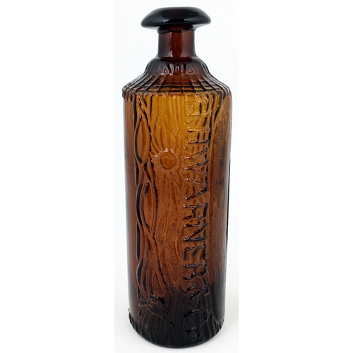 610 - TIPPECANOE BOTTLE. 9.2ins tall. Dark red-amber, heavily embossed canoe & log effect, domed mushroom ... 