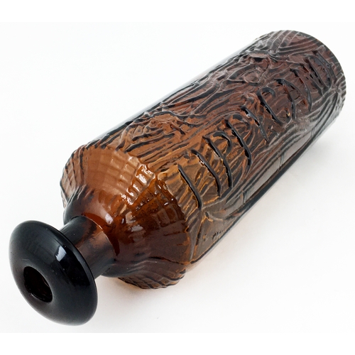 610 - TIPPECANOE BOTTLE. 9.2ins tall. Dark red-amber, heavily embossed canoe & log effect, domed mushroom ... 