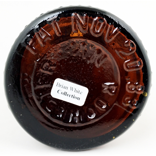 610 - TIPPECANOE BOTTLE. 9.2ins tall. Dark red-amber, heavily embossed canoe & log effect, domed mushroom ... 