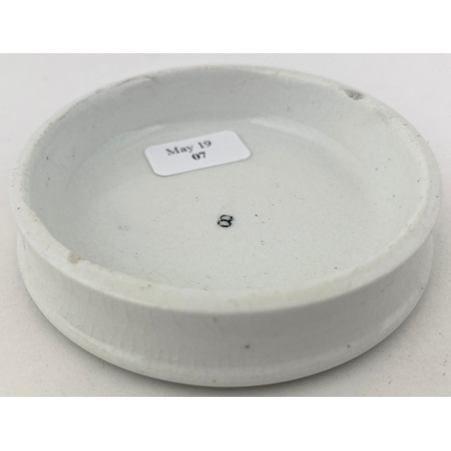 637 - LORIMER CHERRY TOOTH PASTE POT LID. 
 2.5ins diam. Smaller variant to previous lot. Very slight bott... 