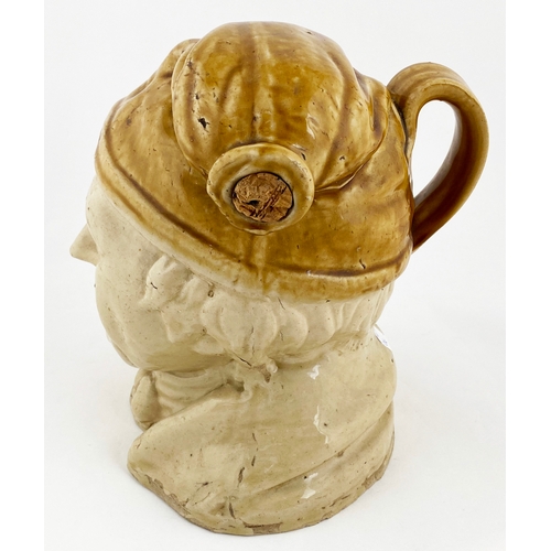 673 - SOUTER JOHNNY HEAD JUG. (Reform Flasks p40) 9.4ins tall, t.t. Bristol type glazes, rear handle, fill... 