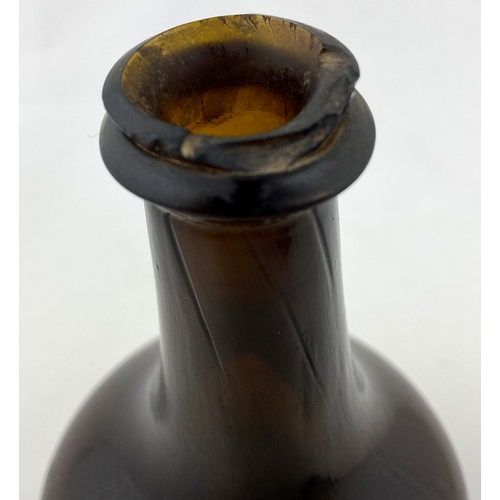 676 - EARLY ENGLISH SPLIT SIZE MALLET WINE BOTTLE. 6.4ins tall. Black/ dark amber glass. Long neck with st... 