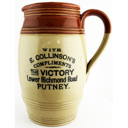 10 - 7.5 ins tall. Two tone bulbous bodied stoneware jug, loop side handle, top section features concentr... 