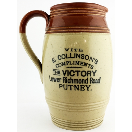 10 - 7.5 ins tall. Two tone bulbous bodied stoneware jug, loop side handle, top section features concentr... 