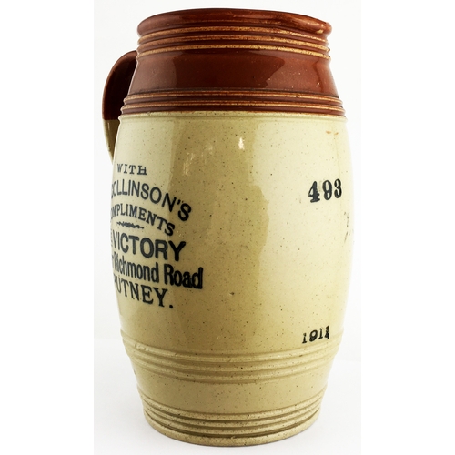 10 - 7.5 ins tall. Two tone bulbous bodied stoneware jug, loop side handle, top section features concentr... 