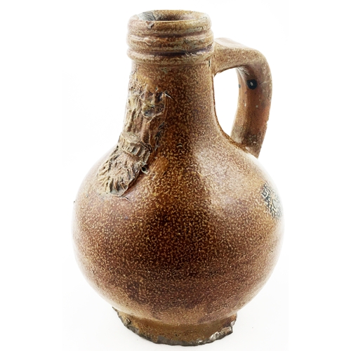 30 - BELLARMINE JUG 6.3ins tall, bulbous body, rear handle, an unusually even range of brown salt glaze. ... 