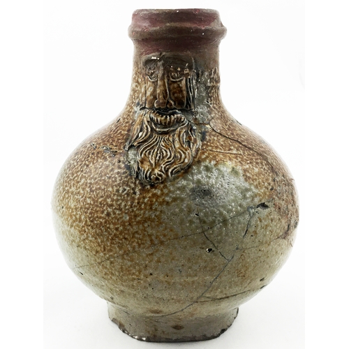 31 - BELLARMINE JUG. 5.2ins tall. The smallest of this grouping (rare size), a very varied salt glaze - d... 