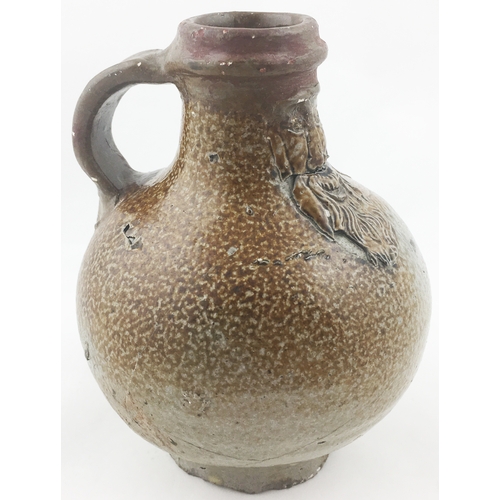 31 - BELLARMINE JUG. 5.2ins tall. The smallest of this grouping (rare size), a very varied salt glaze - d... 