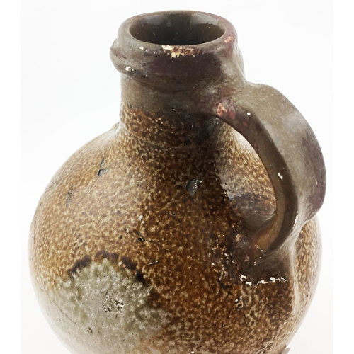 31 - BELLARMINE JUG. 5.2ins tall. The smallest of this grouping (rare size), a very varied salt glaze - d... 