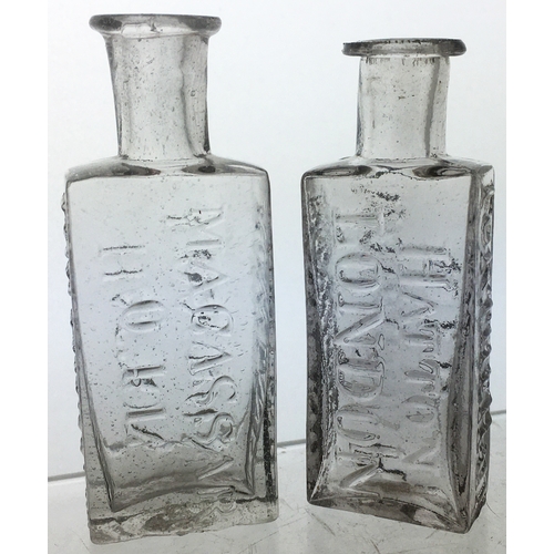 79 - LONDON PONTILLED MACASSAR OIL BOTTLES. Tallest 3.5ins, clear flint glass, wonderful rolled flared li... 