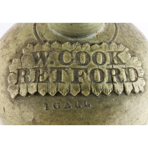 89 - RETFORD SLAB SEALED FLAGON. 11.7ins tall, grey green slip glaze shapely one gallon flagon, rear hand... 