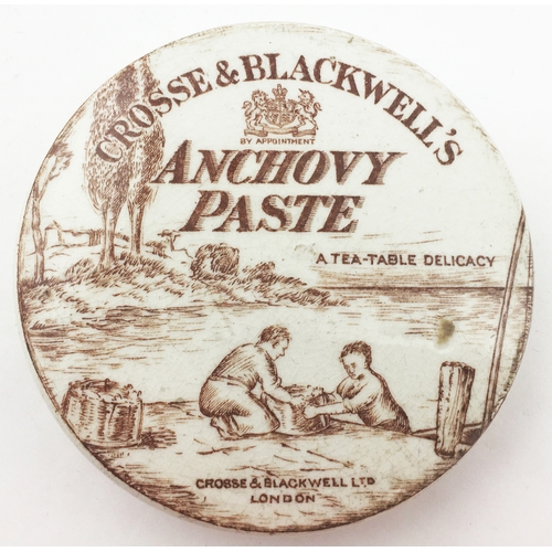 129 - CROSSE & BLACKWELL ANCHOVY PASTE POT LID. 3.3ins diam. Highly pictorial brown print pot lid depictin... 