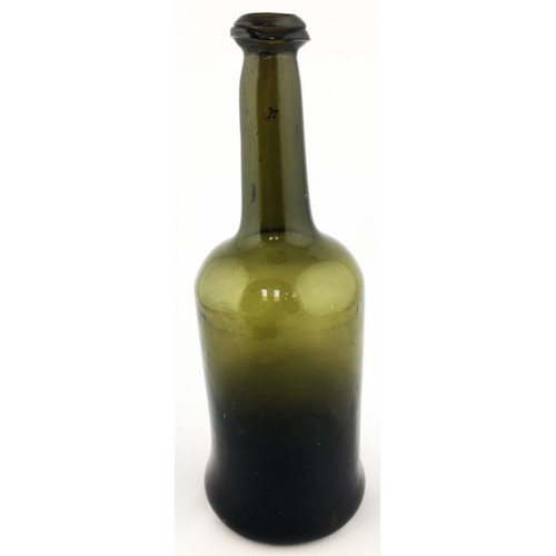 93A - FREEBLOWN WINE BOTTLE. 10.8ins tall. Heavy black glass veering to dark green where thinner. Overall ... 