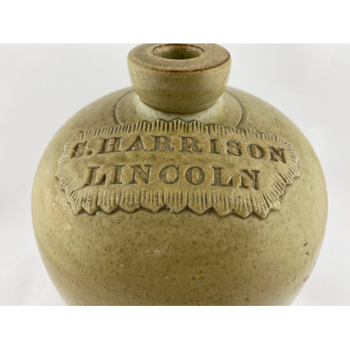 258 - LINCOLN FLAGON. 12ins tall. Green/ grey, impressed pie crust seal, S. HARRISON, 1 GALL to rear. Slig... 