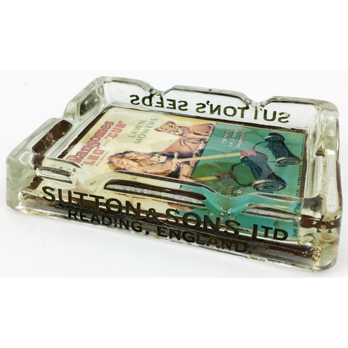 153 - LAWNMOWER ADVERTISING ASHTRAY. 5.5 x 4ins. Unusual rectangular glass ashtray with multi-coloured pri... 