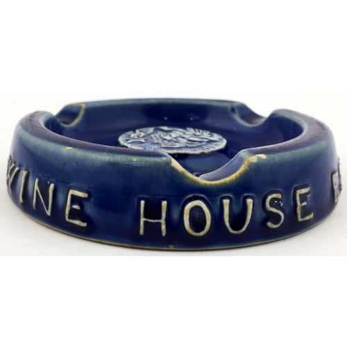 168 - HENEKEYS OLD WINE HOUSE ASHTRAY. 4.8ins diam.  Dark blue stoneware glaze with pict. t.m. Various Dou... 