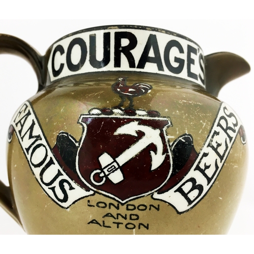 198 - OURAGEâS FAMOUS BEERS JUG. 5.5ins to top of handle. Chunky bulbous form with red & black lettering... 