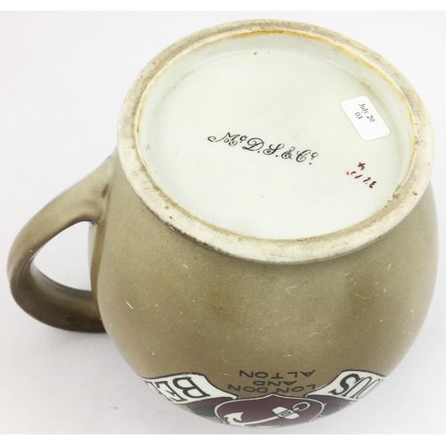 198 - OURAGEâS FAMOUS BEERS JUG. 5.5ins to top of handle. Chunky bulbous form with red & black lettering... 