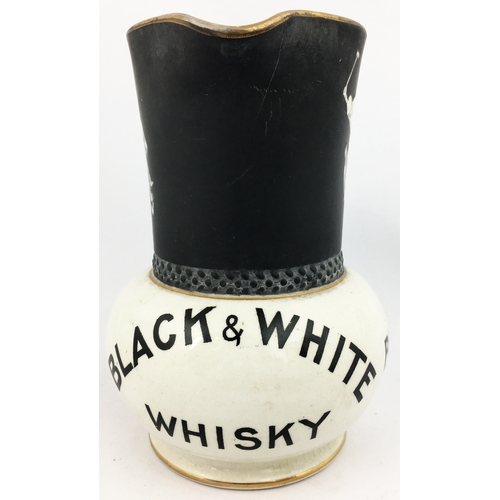 245 - BUCHANANS BLACK & WHITE WHISKY WATER JUG. 6.9ins tall. Something of an iconic jug classic - dubbed T... 