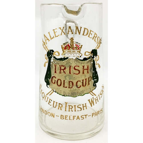 62 - ALEXANDERS LIQUEUR IRISH WHISKY BAR TOP JUG. 6.25ins tall. Clear lead glass, applied handle (crack t... 