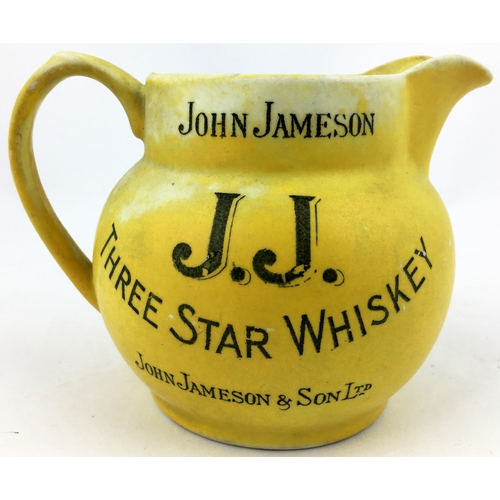 63 - JOHN JAMESON THREE STAR WHISKEY WATER JUG. 4.2ins tall. Matt yellow body (worn, best side shown - se... 