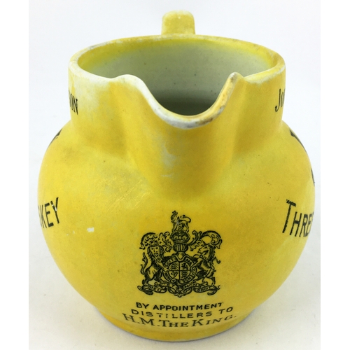 63 - JOHN JAMESON THREE STAR WHISKEY WATER JUG. 4.2ins tall. Matt yellow body (worn, best side shown - se... 