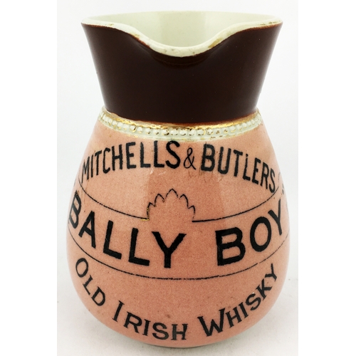 73 - MITCHELL & BUTLERS BALLY BOY OLD IRISH WHISKY WATER JUG. 4.5ins tall. Pink body, black 3 lined trans... 