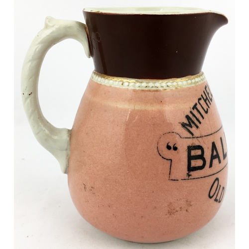 73 - MITCHELL & BUTLERS BALLY BOY OLD IRISH WHISKY WATER JUG. 4.5ins tall. Pink body, black 3 lined trans... 