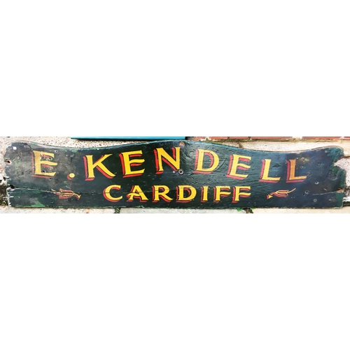 78 - CARDIFF WOODEN CART PAINTED PANEL. 57.5 x 12ins. An unusual advertising survivor of a hand painted w... 