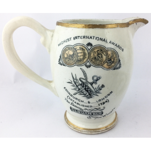 94 - UAM VAR WHISKY WATER JUG. 5.4ins tall. Colourful transfer one side, gold medals etc to other - see e... 