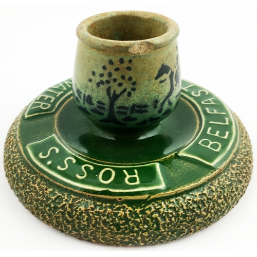 1 - ROSS'S BELFAST SODA WATER MATCHSTRIKER ASHTRAY. 3ins tall 5.5ins diam.dark green glaze with black ho... 