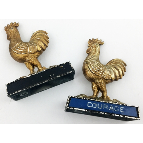 102 - COURAGE CAST COCKEREL DUO. 2.5ins tall. Sculptural metal cockerels on bases, name to front of each, ... 