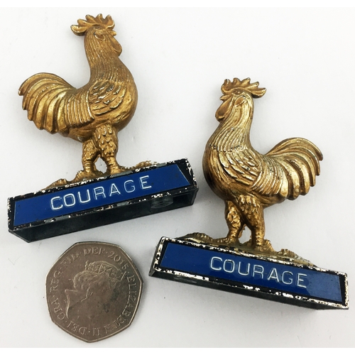 102 - COURAGE CAST COCKEREL DUO. 2.5ins tall. Sculptural metal cockerels on bases, name to front of each, ... 