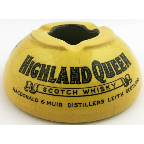 113 - HIGHLAND QUEEN SCOTCH WHISKY ASHTRAY. 4.5ins diam. Mustard coloured dome, main lettering tartan styl... 