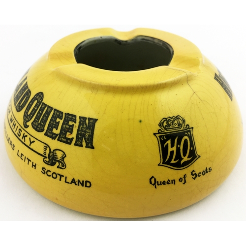 113 - HIGHLAND QUEEN SCOTCH WHISKY ASHTRAY. 4.5ins diam. Mustard coloured dome, main lettering tartan styl... 