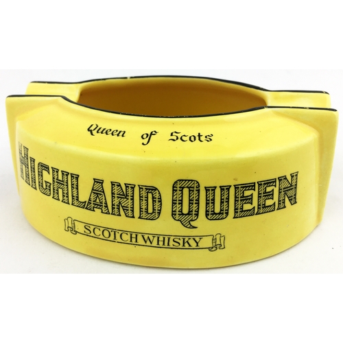 114 - HIGHLAND QUEEN SCOTCH WHISKY ASHTRAY. 4.75 by 3.5ins diam. Mustard coloured oval, black edging to to... 