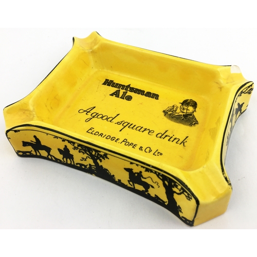 115 - HUNTSMAN ALE ASHTRAY. 5.5 x 4.5ins Rectangular mustard coloured body. Huntsman pict. t.m. in centre ... 