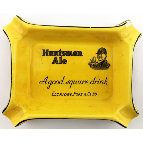 115 - HUNTSMAN ALE ASHTRAY. 5.5 x 4.5ins Rectangular mustard coloured body. Huntsman pict. t.m. in centre ... 