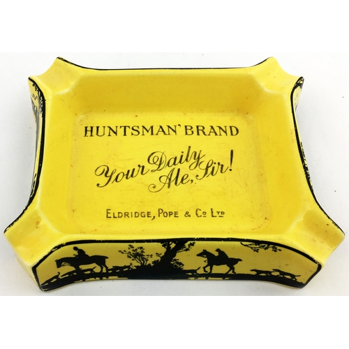 116 - HUNTSMAN BRAND ASHTRAY. 5.5 x 4.4ins Rectangular mustard coloured with lettering in centre, fox hunt... 