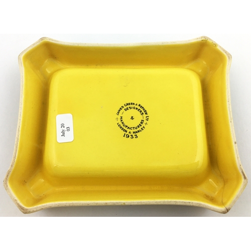 116 - HUNTSMAN BRAND ASHTRAY. 5.5 x 4.4ins Rectangular mustard coloured with lettering in centre, fox hunt... 