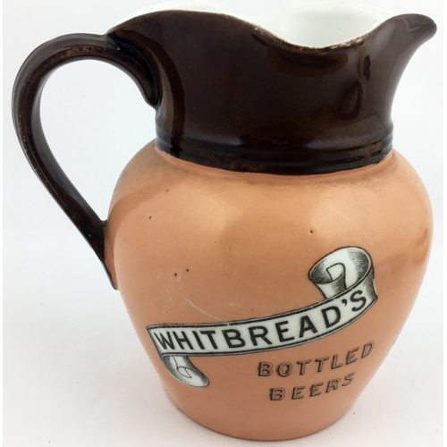 119 - WHITBREADS BOTTLED WATER JUG. 6.2ins tall. Top dark brown, flesh lower, dark brown to handle & neck.... 