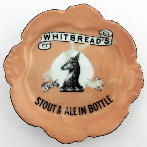 120 - WHITBREADS ASHTRAY. 5.5ins diam. Flesh coloured body black rim, Whitbread pict. trade mark to centre... 